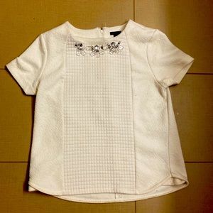 Worn bedazzled Ann Taylor cream top